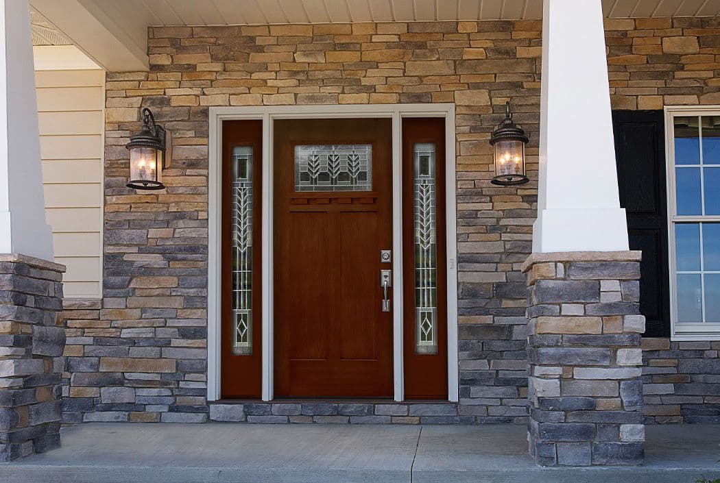 red wooden door on brick home